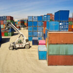 Reach Stacker Moving Cargo Containers at Inland Port