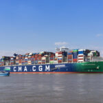 Container vessel CMA CGM CONCORDE on Elbe river heading to Hamburg.