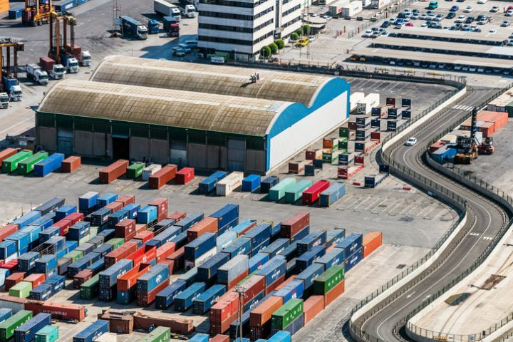 Aerial view of Containers and warehouse in Port De Barcelona (Catalonia), Spain Aerial view of Containers and warehouse in Port De Barcelona (Catalonia), Spain.