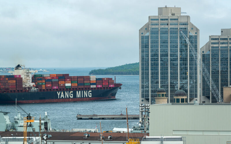 Halifax, Canada - June 29, 2020 - The YM Modesty container ship navigates narrow Halifax Harbour heading for another port.